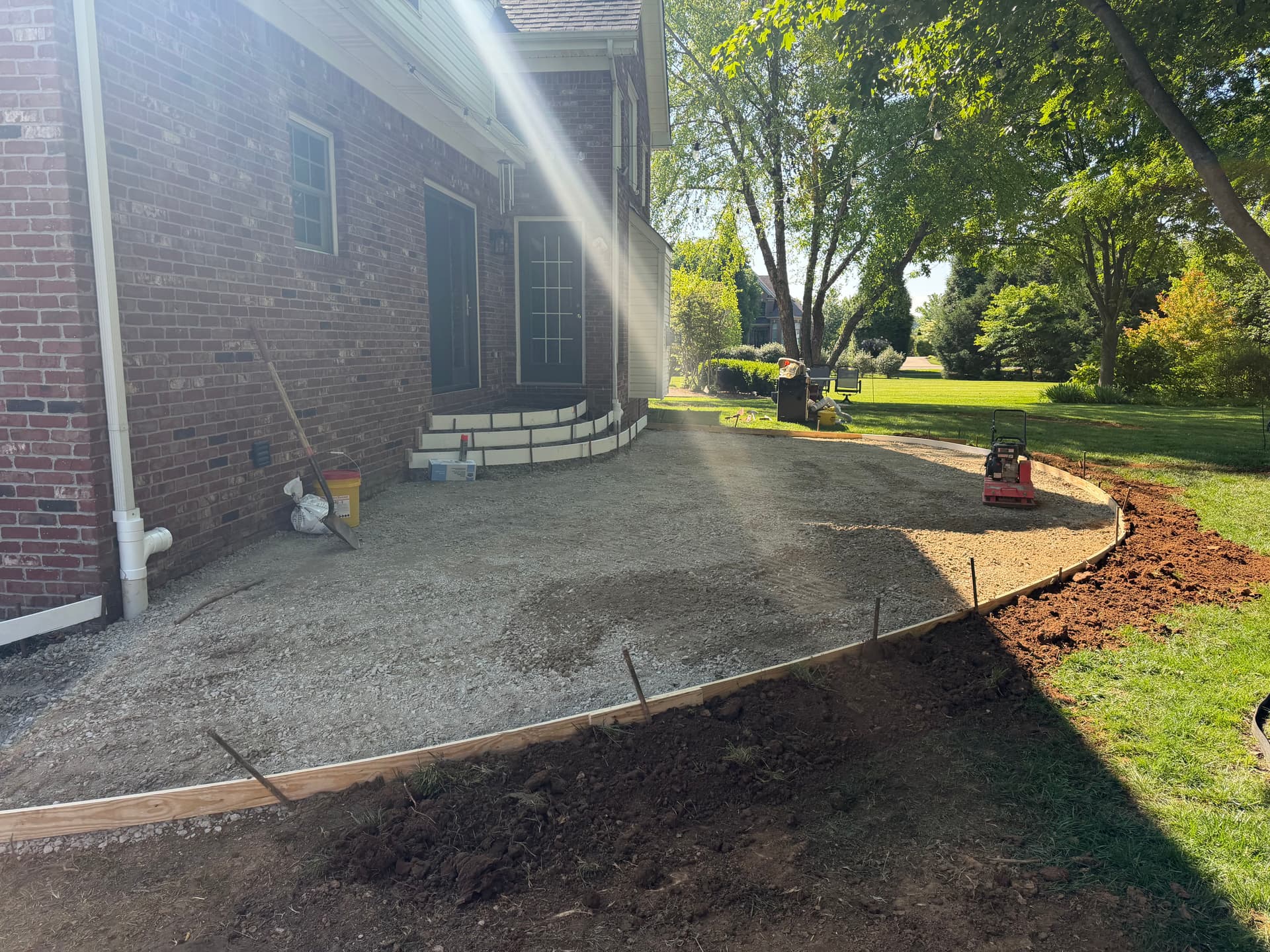 Gallery photos for Sunken Paver Patio Replaced With a Larger Exposed Concrete Outdoor Patio: Image #5