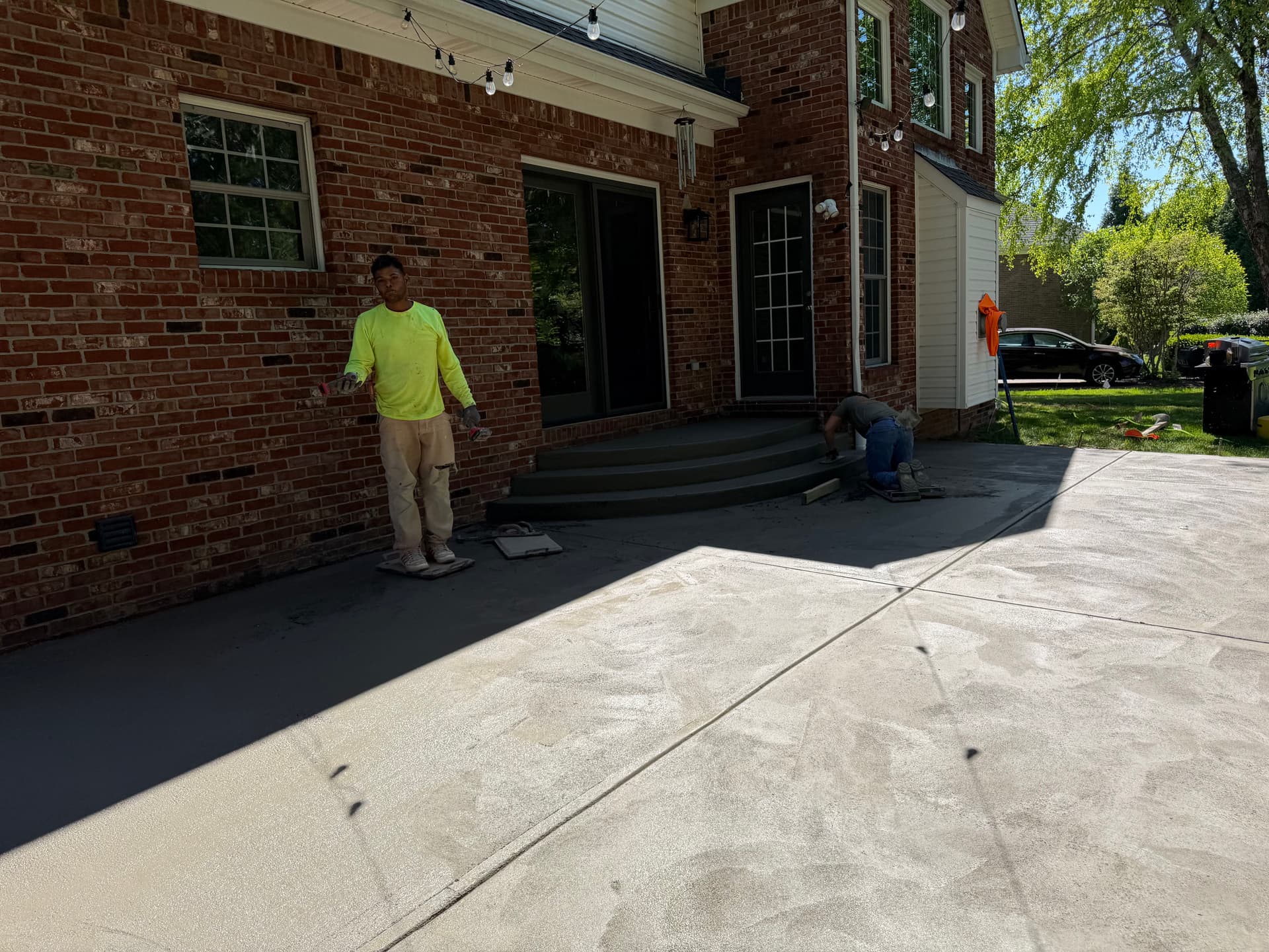 Gallery photos for Sunken Paver Patio Replaced With a Larger Exposed Concrete Outdoor Patio: Image #3