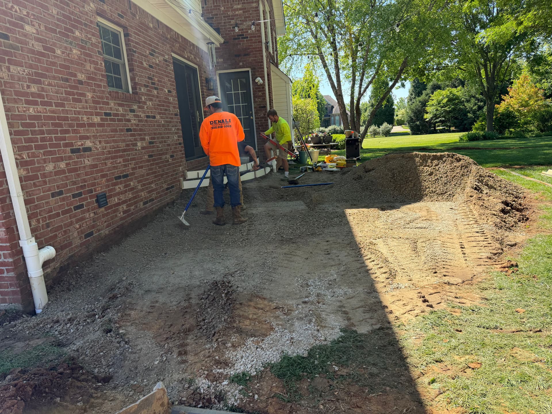 Gallery photos for Sunken Paver Patio Replaced With a Larger Exposed Concrete Outdoor Patio: Image #7