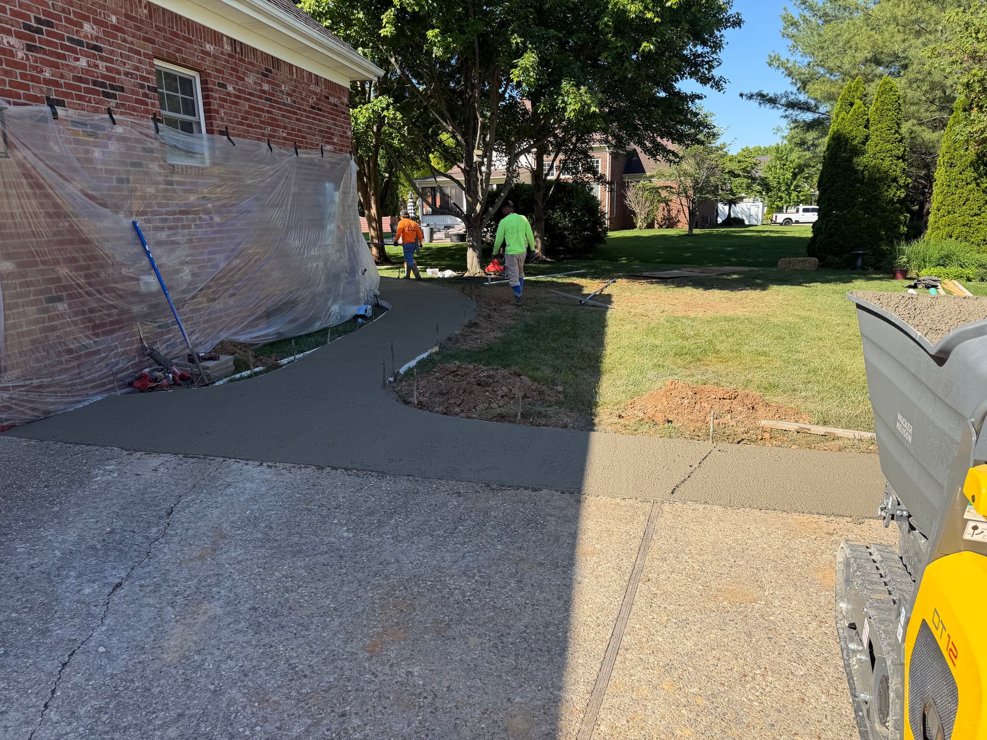 Gallery photos for Sunken Paver Patio Replaced With a Larger Exposed Concrete Outdoor Patio: Image #2